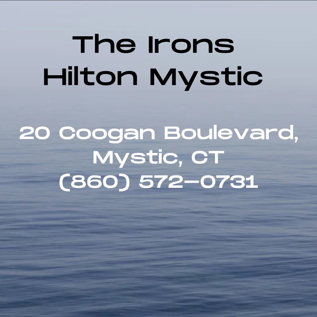 The Irons Restaurant and Bar, located inside Hilton Mystic at 20 Coogan Boulevard, is a modern American eatery celebrated for its locally sourced seafood, creative classics, and seasonal dishes served in a stylish setting inspired by Mystic’s shipbuilding heritage.